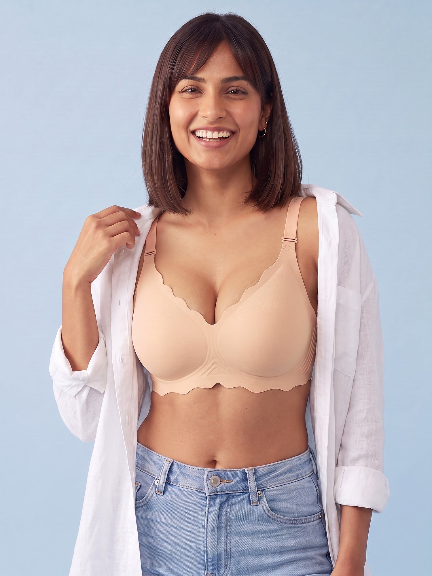 Woman wearing the Bugario Cloudy jelly bra in Nude under an open white shirt